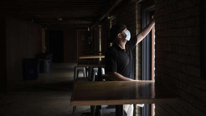 Kevin Shipp, operating partner of Cedar Street Courtyard, closes his bar on West 4th Street on Friday June 26, 2020, after Gov. Greg Abbott ordered all bars in Texas to be closed due to the coronavirus.