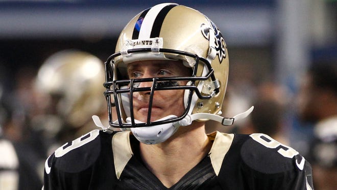 New Orleans Saints quarterback Drew Brees (9) on the sidelines during the fourth quarter against the Dallas Cowboys at AT&T Stadium. Dallas beat New Orleans 38-17.