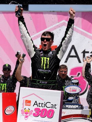 Erik Jones celebrates with his crew in Victory Lane after winning the NASCAR Xfinity series auto race at Chicagoland Speedway, Sunday.
