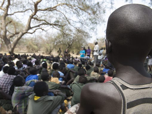 Young boys attend a ceremony of the child soldiers