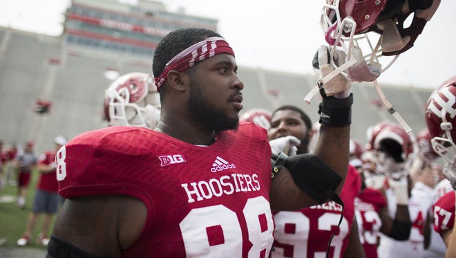 Indiana defensive lineman Darius Latham (98) sings the alma mater after the Cream and Crimson Spring Game on Saturday, April 18, 2015, at Memorial Stadium in Bloomington. (James Brosher / For The Star)