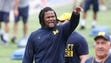 Michigan player Rashan Gary works with high school