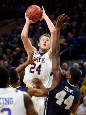 SDSU's Mike Daum goes up for a shot over Oral Roberts' Albert Owens on Saturday at Frost Arena in Brookings.