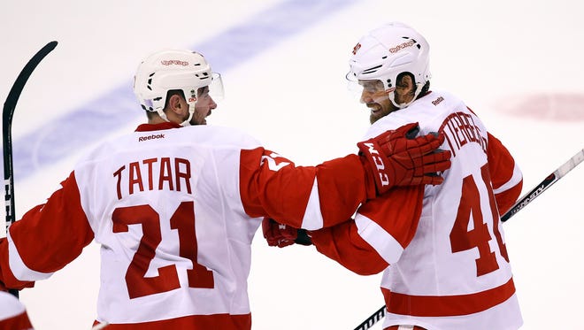 Oct 27, 2016; St. Louis, MO, USA; Red Wings left wing Henrik Zetterberg celebrates with Tomas Tatar after scoring the game-winning goal during a shoot-out against the St. Louis Blues at Scottrade Center.