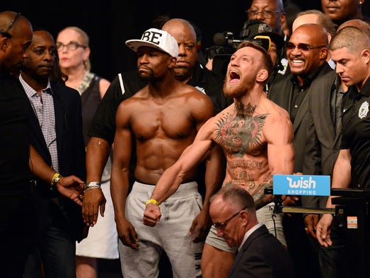 Floyd Mayweather Jr. (left) and Conor McGregor pose