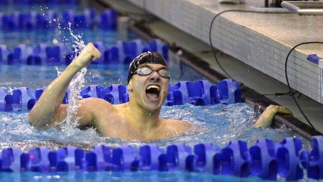 Brockport's Brandon Amthor celebrates his win in the 200-yard individual medley with a time of 1:53.34 during the Section V Class B Swimming Championships at the Webster Aquatic Center on Friday.