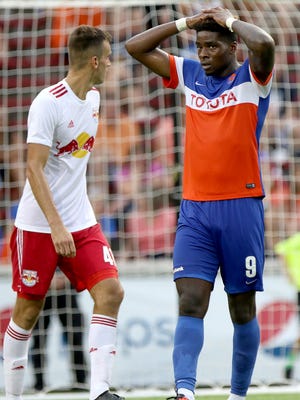FC Cincinnati's Sean Okoli, reacts to a missed goal against the New York Red Bulls II in the first half Wednesday July 20, 2016 at Nippert Stadium.