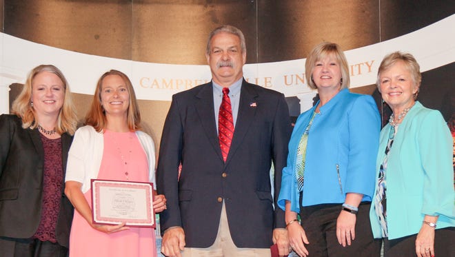 Brooke Morgan, second from left, and David Curtis from the Union County School System were honored by Campbellsville University. Presenting the awards were Dr. Donna Hedgepath, far left, provost and vice president for academic affairs, and Dr. Beverly Ennis, dean of the School of Education. Also attending was Patricia Sheffer, superintendent.