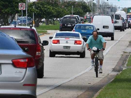 should i ride my bike with or against traffic