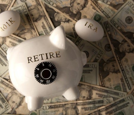 Piggy Bank with retire written on it. Eggs with 401k and IRA written on them, all on top of US cash