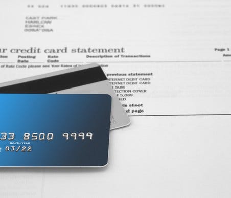 Credit cards resting on a credit card statement