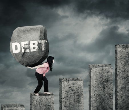 A person carrying a boulder up granite stairs. The bounder has the word debt written on it.