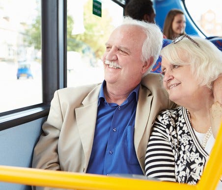 Senior couple riding a bus