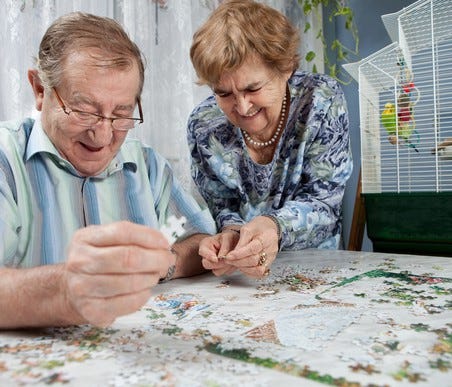 Senior couple doing a puzzle