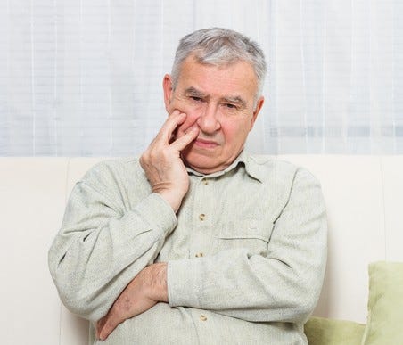 Older man looking worried