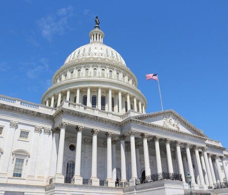 U.S. Capitol seen from left of center on a clear day.
