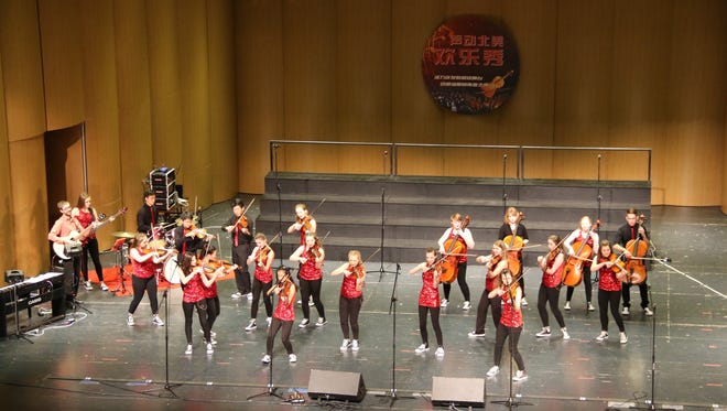 A group of orchestra students from Neenah High School traveled to China last month performed at five different venues in nine days