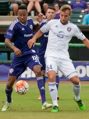 Louisville City FC midfielder Mark Anthony Kaye and Orlando City  B forward Keegan Smith vie for the ball during LouCity's 2-1 loss on Saturday, July 30, 2016.