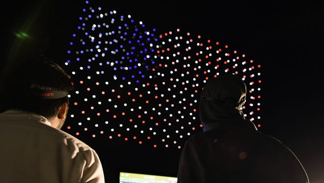 Two Intel drone technicians troubleshoot a choreographed drone display ahead of a 4th of July showing celebrating the holiday June 28 at Travis Air Force Base, Calif. This year's July 4th marks the 242nd year since the creation of the United States.