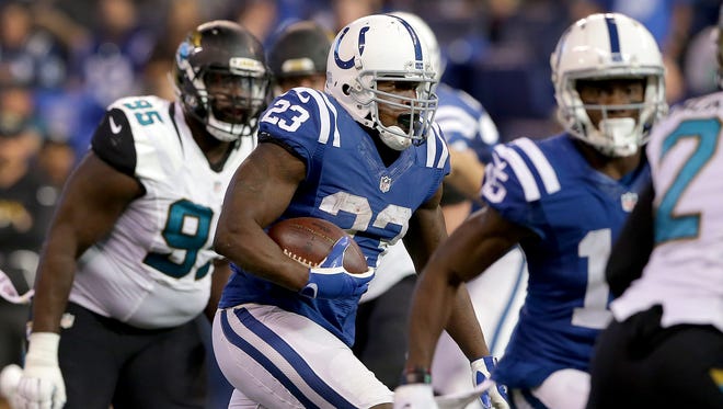 Indianapolis Colts running back Frank Gore (23) runs by the Jacksonville Jaguars defense n the second half of  their NFL football game Sunday, Jan.1, 2016, at Lucas Oil Stadium. The Indianapolis Colts defeated the Jacksonville Jaguars 24-20.