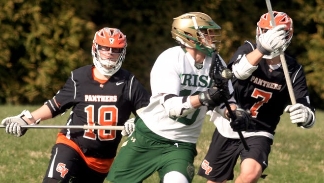 York Catholic's Cole Witman, center, has now committed to play college lacrosse for the University of Tampa, an NCAA Division II program. Witman had previously been committed to Johns Hopkins, an NCAA Division I power.