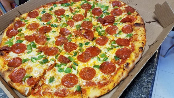 Rhino’s thick-crusted pizza is topped with homemade sauce, and the toppings are always good quality and fresh.