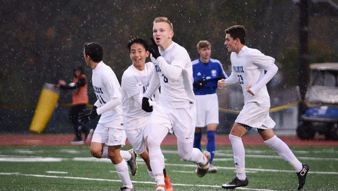 Connor Conyngham (no. 6) of Waldwick (in white) celebrates his goal with his teammates against Wallington in the second half during the North 1, Group 1 state semifinal at Waldwick High School on 11/07/17. 