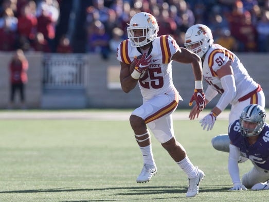 Iowa State Cyclones running back Mike Warren (25) runs