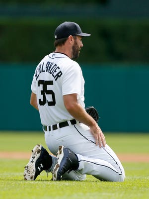 Detroit Tigers starting pitcher Justin Verlander on his knees for a moment after trying to dive for a ground ball in the second inning of their 7-2 loss to the Boston Red Sox on August 9, 2015, in Detroit.