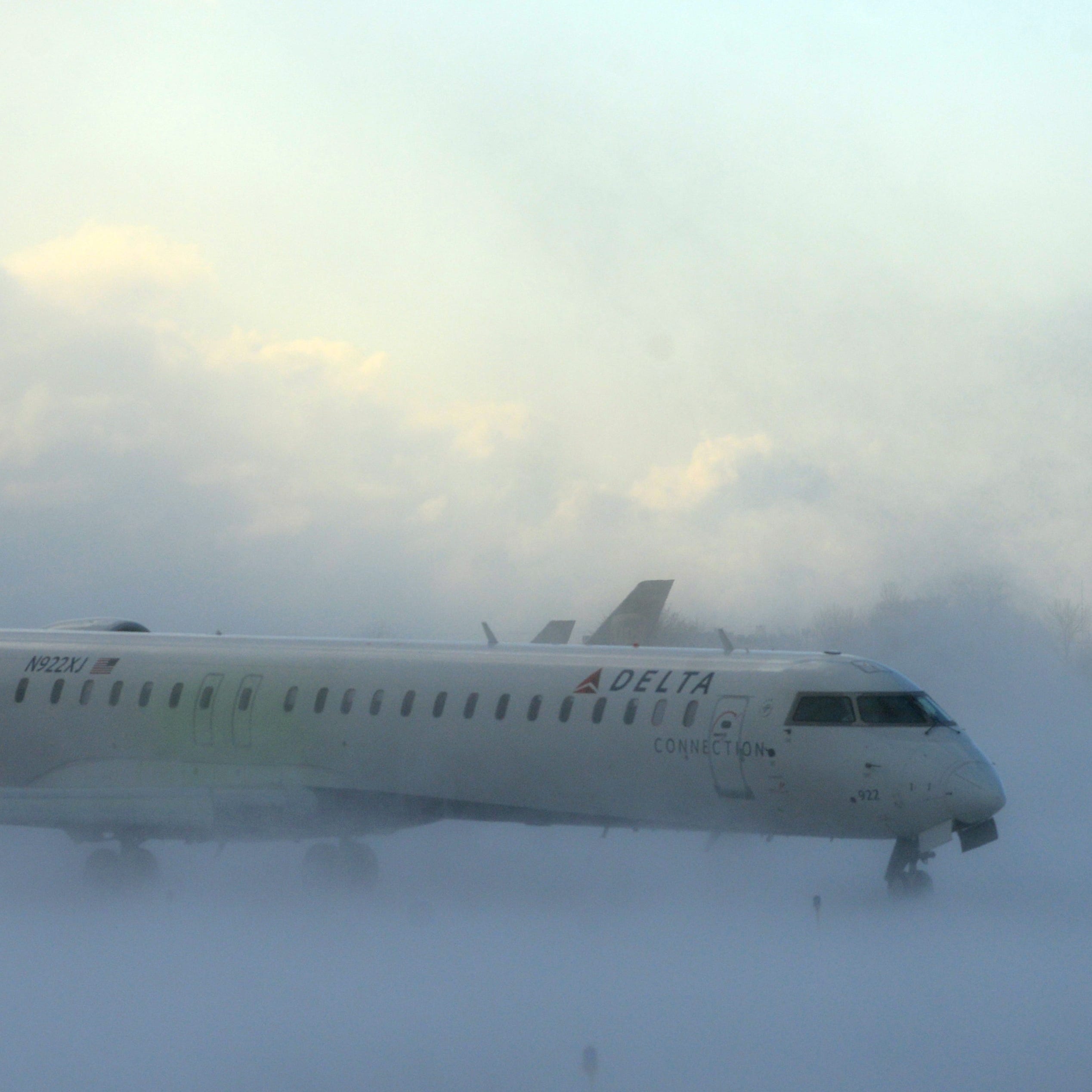 Lake-effect snow storm with freezing temperatures affected travel, like this plane that negotiated its way through the snow at Buffalo Greater International Airport, in Buffalo, N.Y. Tuesday, Nov. 18, 2014. Temperatures fell to freezing or below at r