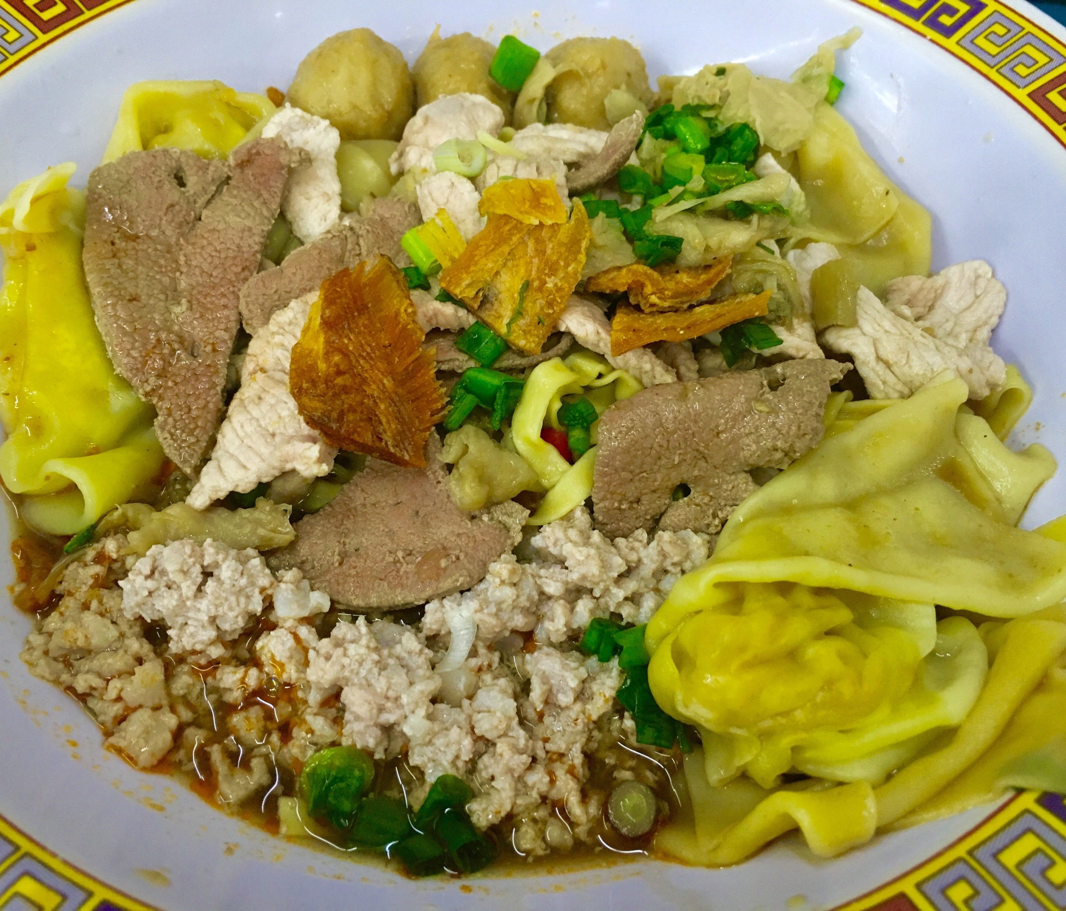 Hill Street Tai Hwa Pork Noodle's specialty dish is  bak chor mee. The noodles are tossed in black vinegar and chili paste and topped with pork dumplings, minced pork and meatballs. There is also dried sole fish mixed in.