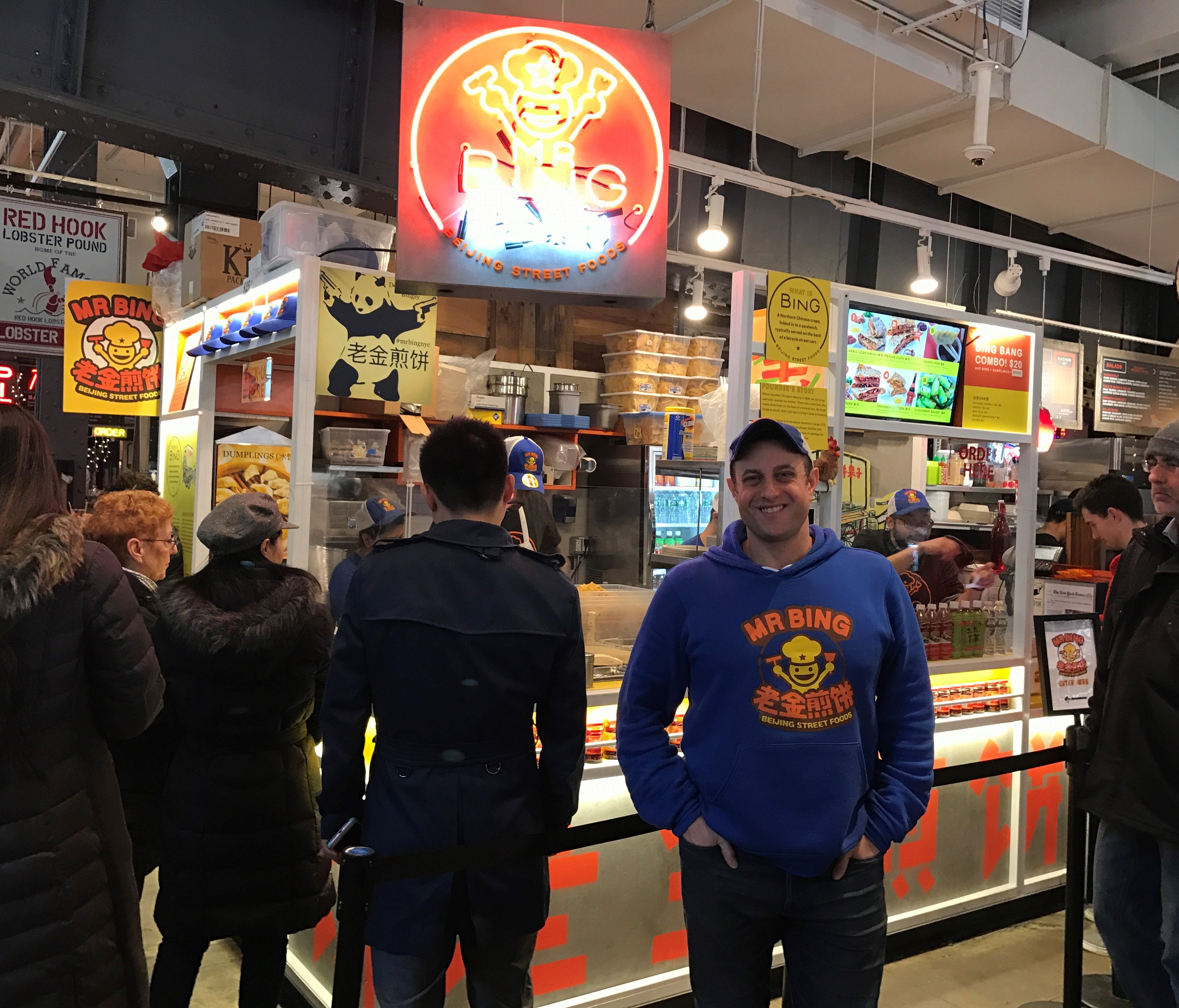 Brian Goldberg stands in front of his new Mr Bing kiosk inside Urbanspace Vanderbilt in Manhattan, where he sells savory-spicy crepes called 
