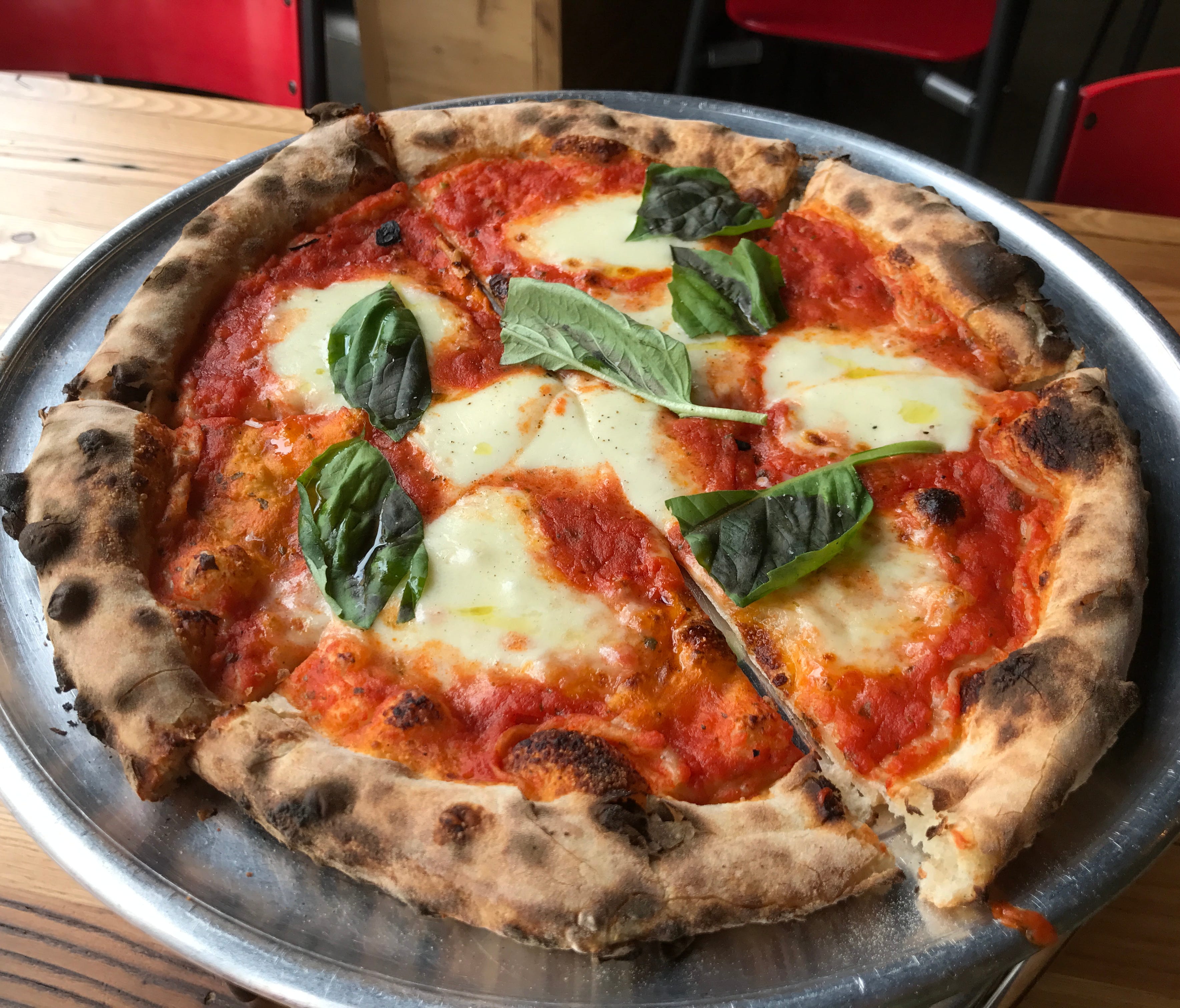 Excellent crust that captures the smokiness of the wood burning oven is the base that these great pizzas are all built upon. This is the classic Margherita, with fresh mozzarella, basil and tomato sauce.