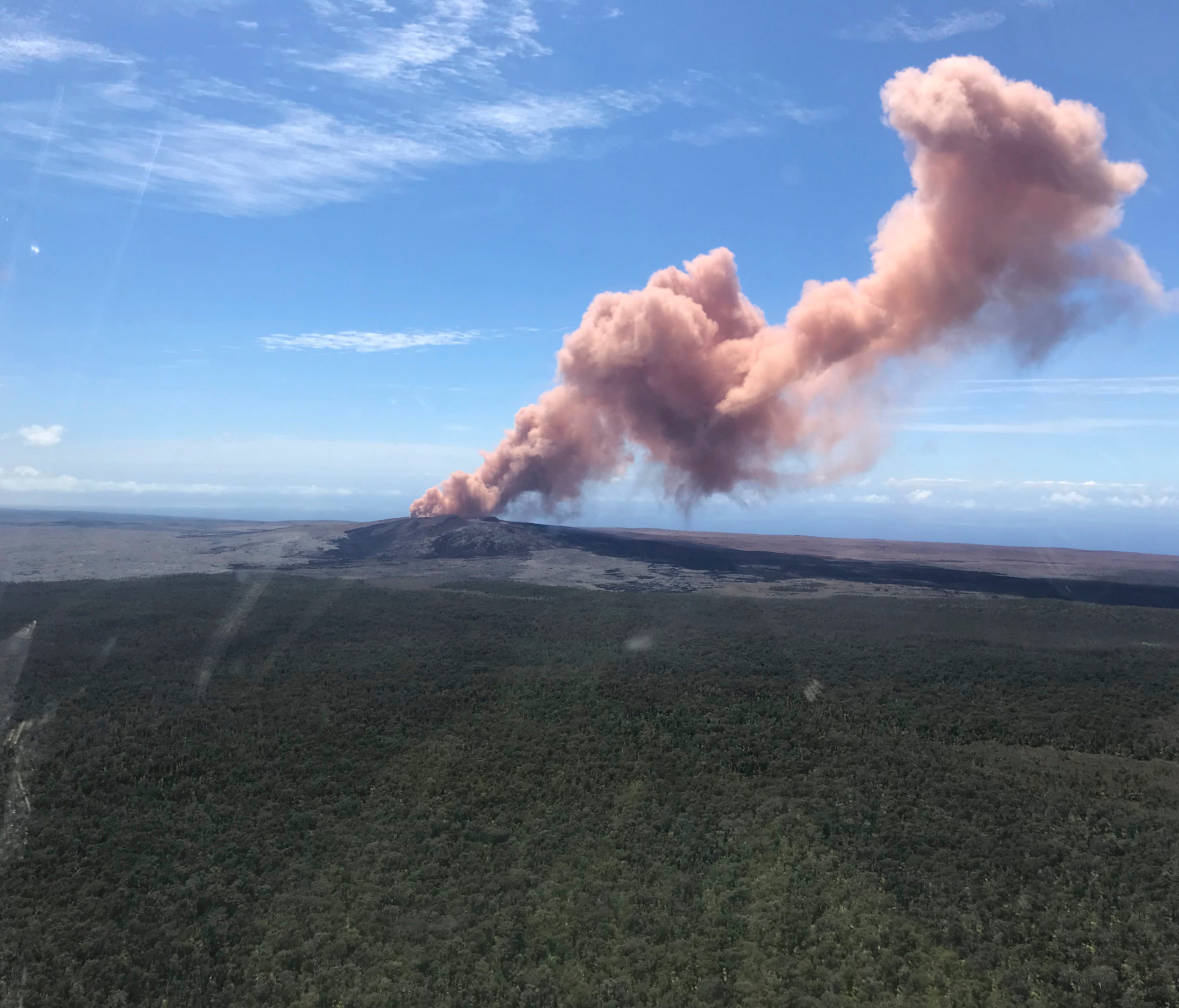 In this photo, provided by the U.S. Geological Survey, red ash is pictured rising from the Puu Oo vent on Hawaii's Kilauea Volcano after a magnitude-5.0 earthquake struck the Big Island on Thursday.