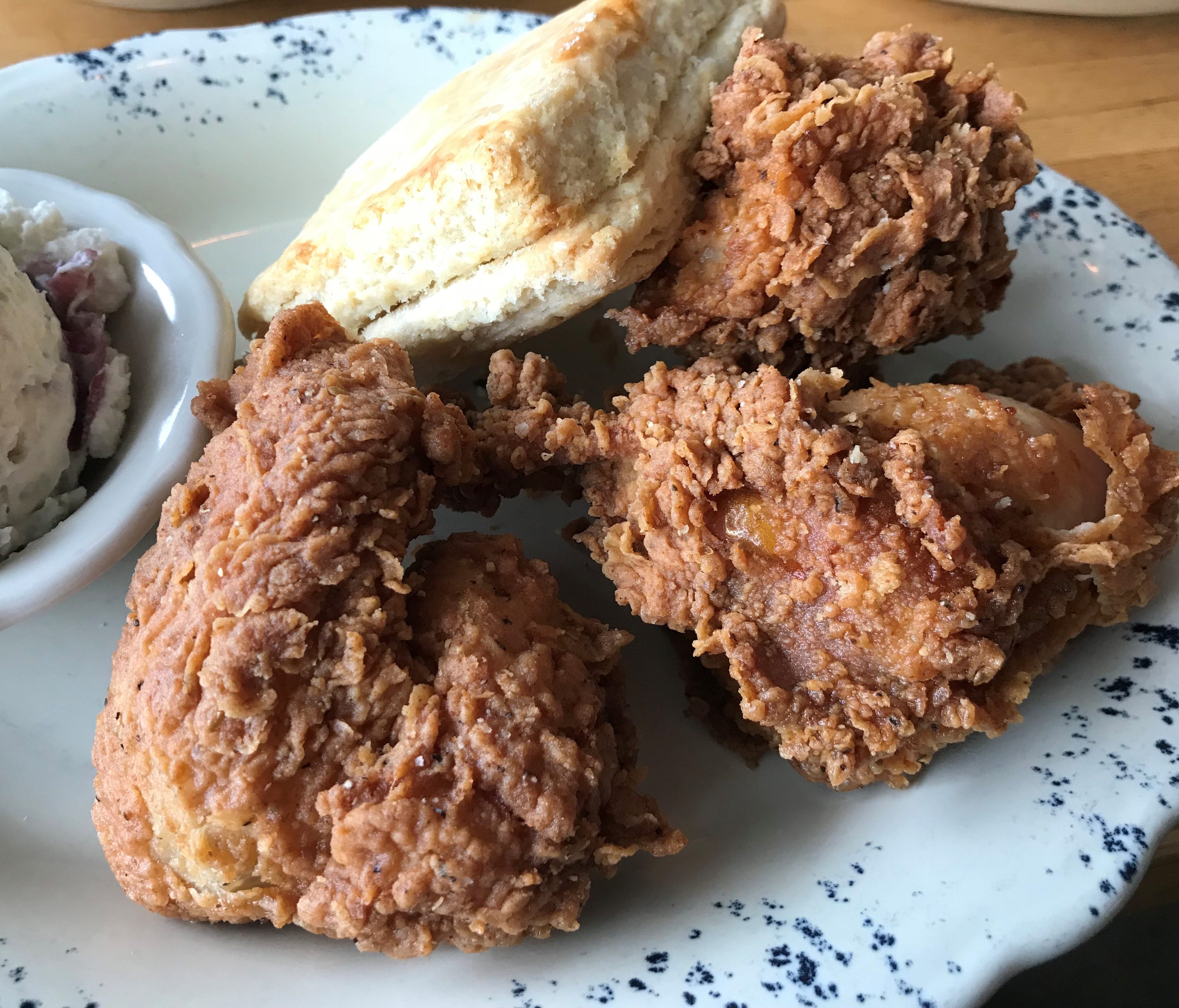 A close-up of the delicious, crispy, craggy coating on the fried chicken at Whistle Britches.