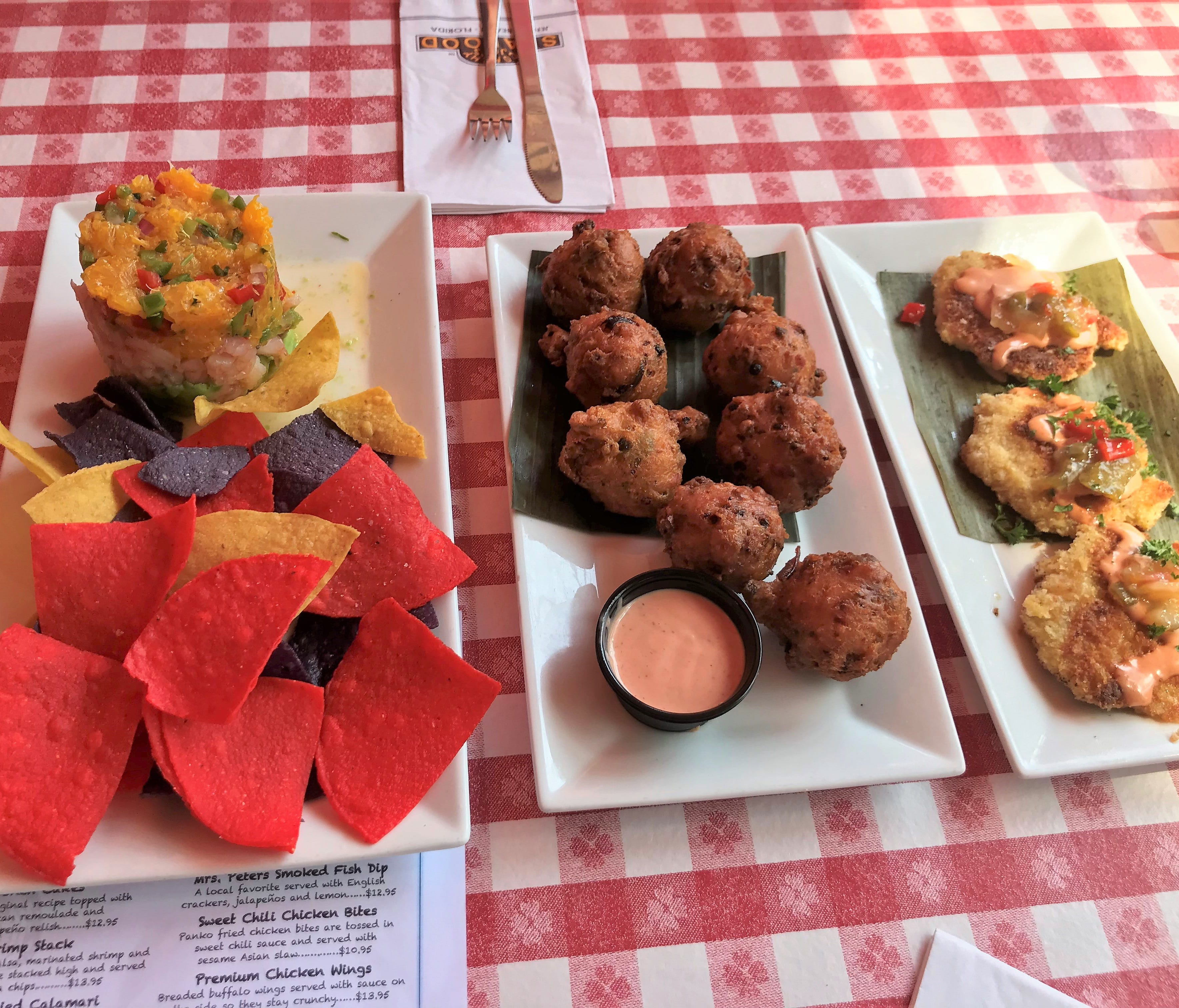 The three most popular starters at Conchy Joe's, from left to right: shrimp stack, conch fritters and conch cakes.