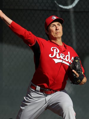 Reds starting pitcher Homer Bailey throws during a bullpen session on Friday,