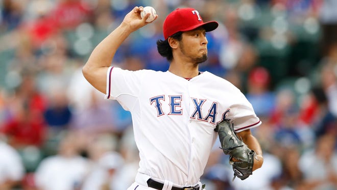 Texas Rangers starting pitcher Yu Darvish (11) throws during the first inning against the New York Yankees at Globe Life Park in Arlington.