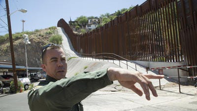 U.S. Customs and Border Protection, PIO Peter Bidegain, shows one of the sealed drug tunnel on East International Street closed to border fence in Nogales, Az, on Thursday, May 22, 2014.
