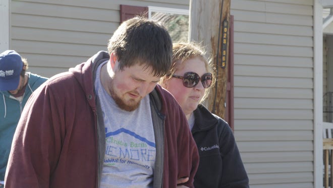 From left, Doug and Betsy Shaw speak before a crowd gathered at their future home, currently under construction through Habitat for Humanity of Lafayette, on April 8, 2017, in Lafayette.