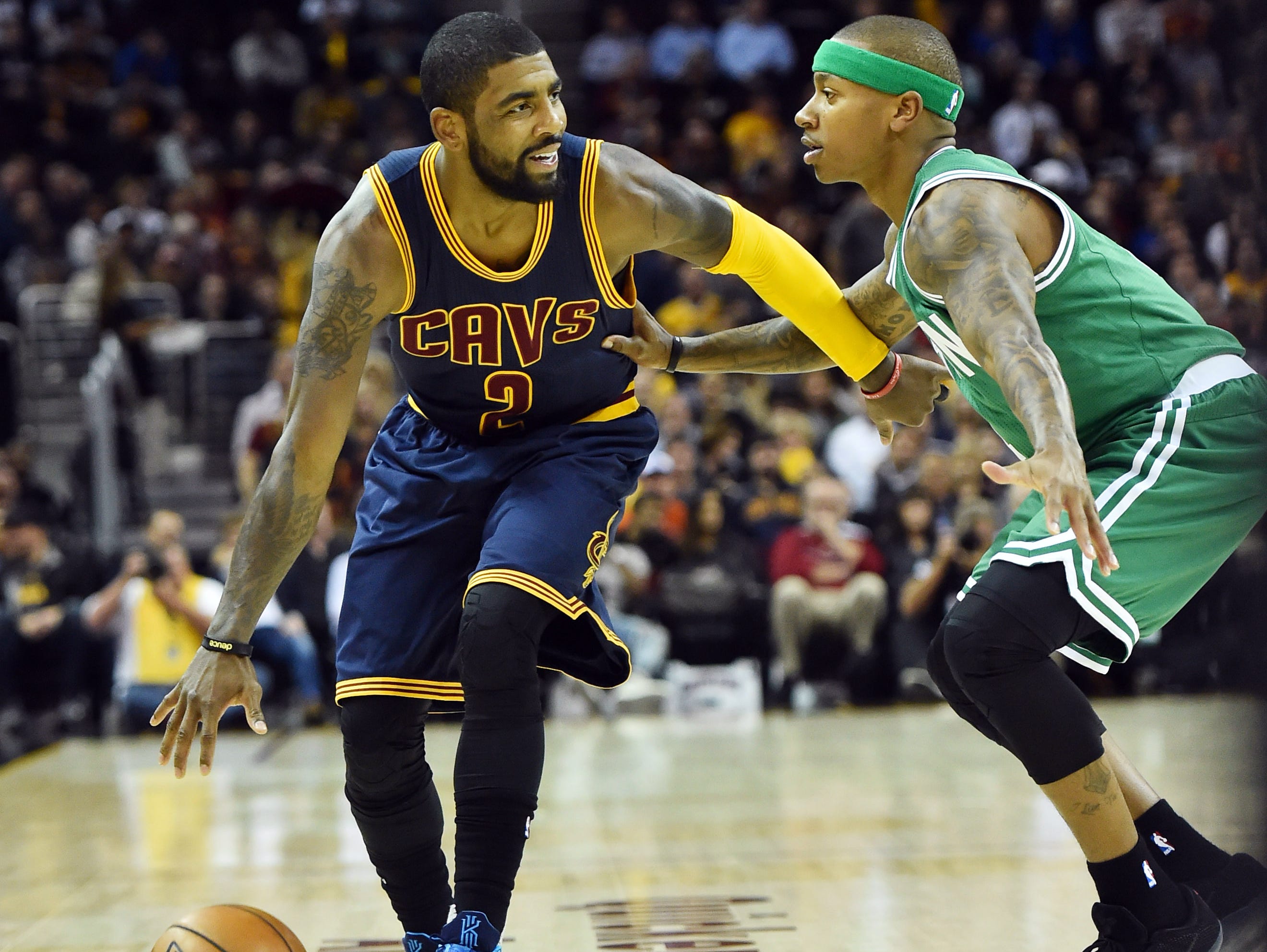 Cleveland Cavaliers guard Kyrie Irving (2) dribbles against Boston Celtics guard Isaiah Thomas (4) during the first quarter at Quicken Loans Arena.