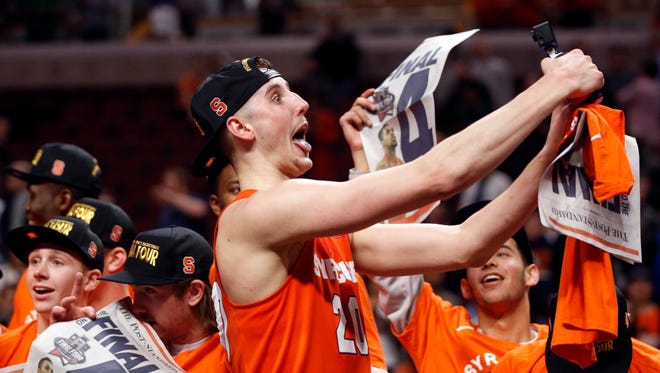Syracuse's Tyler Lydon celebrates with his teammates after reaching the 2016 Final Four by beating Virginia on March 27, 2016.