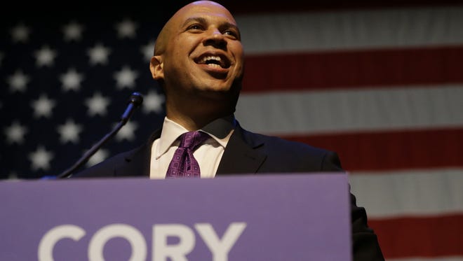 Cory Booker talks to supporters on election night after winning a special election for the U.S. Senate.