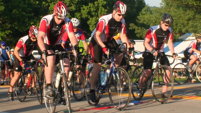 Riders take off from the starting line during a 2009  Tour de Cure race at Big Bone Lick State Park in Union.