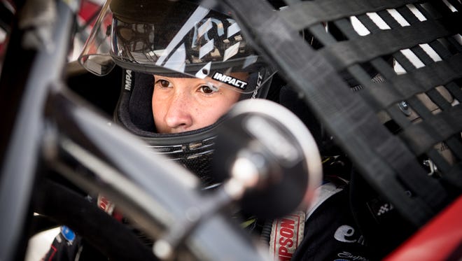 13-year-old race car driver Jake Garcia gets situated in his car before practice at the Fairgrounds Speedway in Nashville, Tenn., Friday, March 9, 2018.