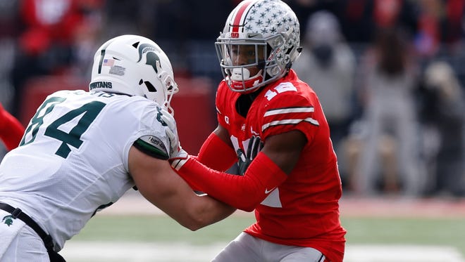 Ohio State cornerback Denzel Ward defends in a 2017 game against Michigan State .