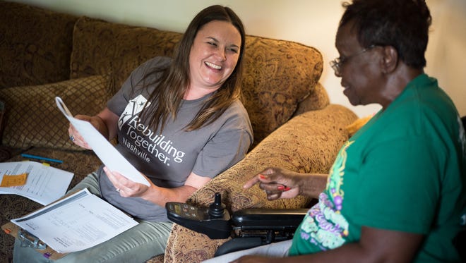Amanda Frick Keiser, left, of Rebuilding Together Nashville speaks with Lillian Williams, right, about maintenance they will perform at her home, Tuesday, June 12, 2018, in Nashville, Tenn.