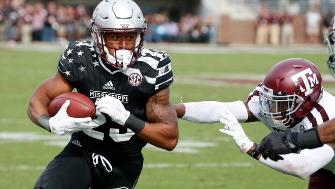 Mississippi State wide receiver Keith Mixon (23) runs upfield past a Texas A&M defender for a short yardage reception during the second half of a game last season.