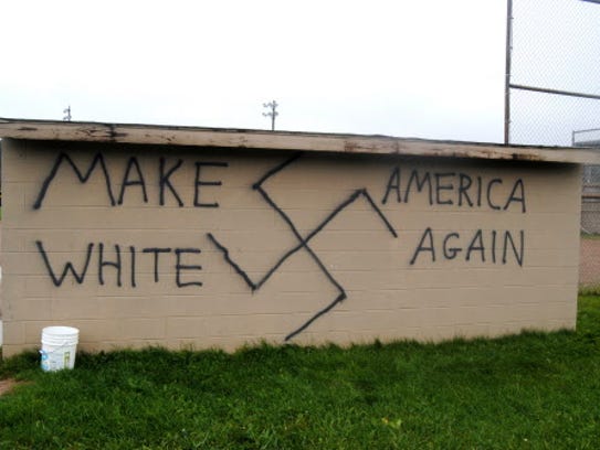 Graffiti of swastika on a softball field dugout in