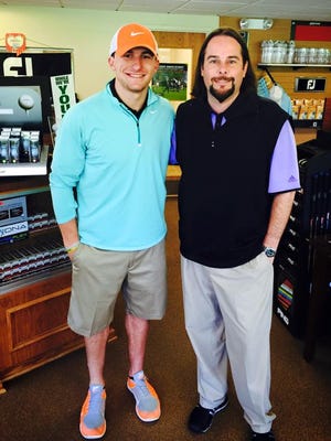 Cleveland Browns quarterback Johnny Manziel (left) and East Ridge assistant professional Brian Hall pose for a photo during ManzielÕs trip to Shreveport, La. on Saturday. Manziel was in town to play golf.
